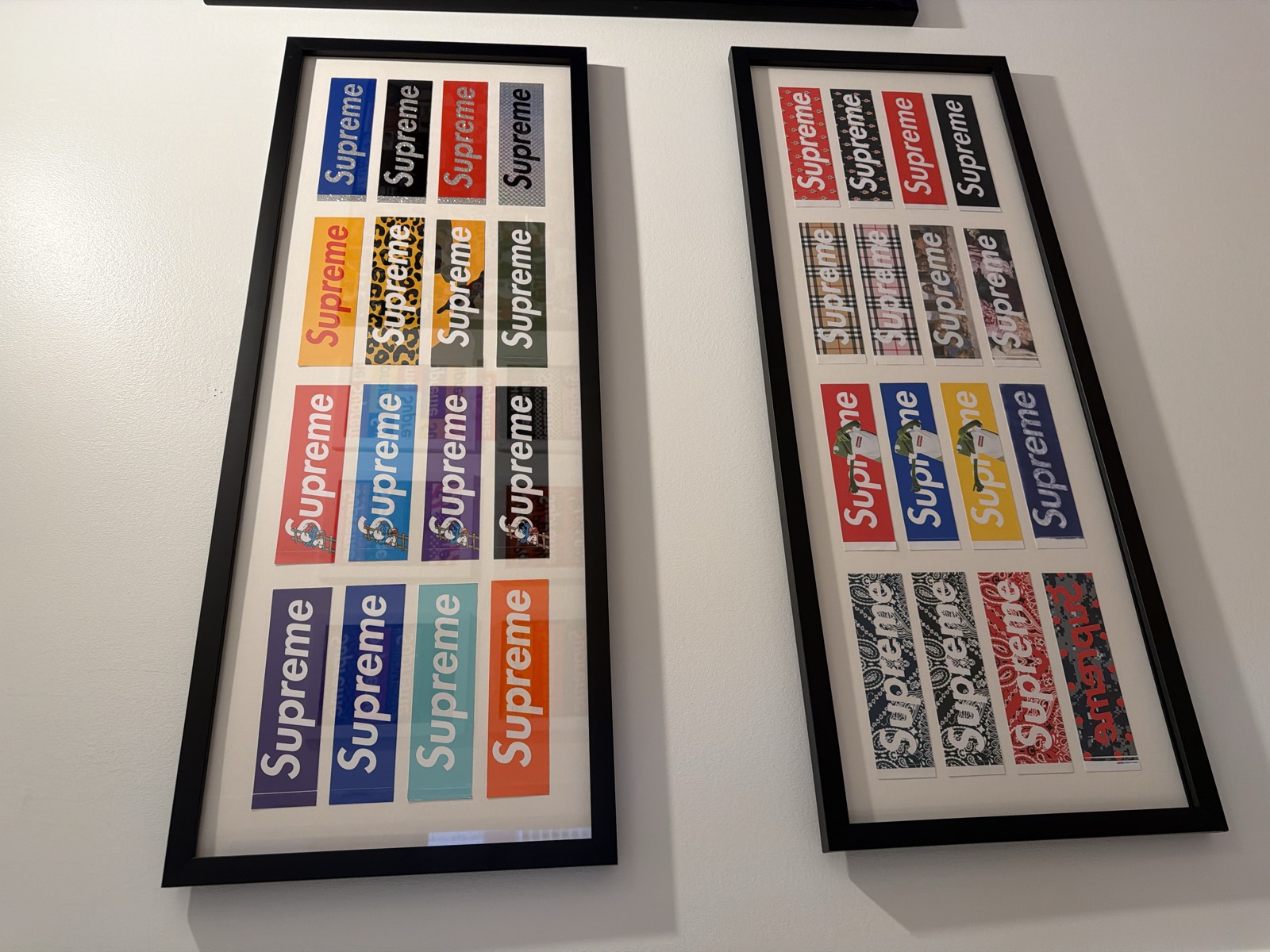 Alternate installed view of two framed 16-logo studies