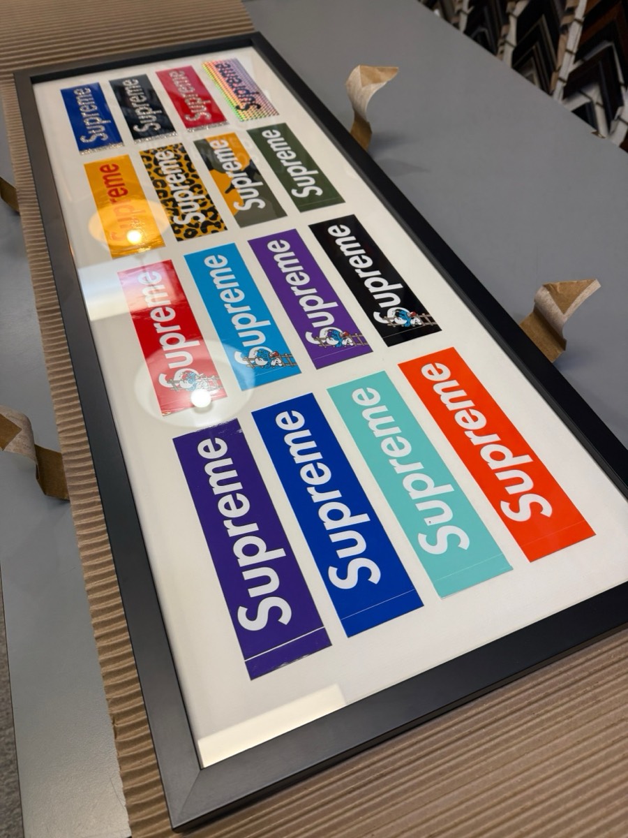 Long framed sticker display at the frame shop