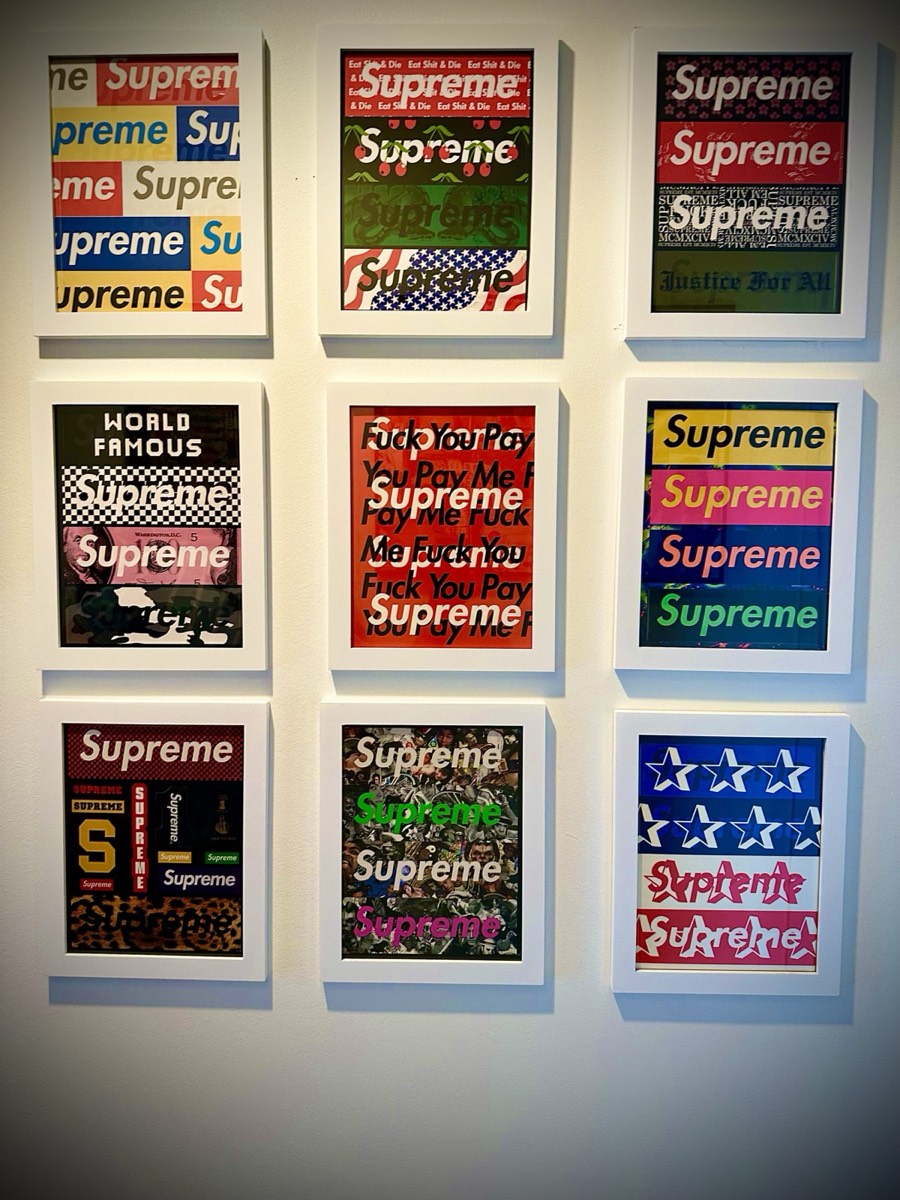 Nine framed collector displays arranged on a wall