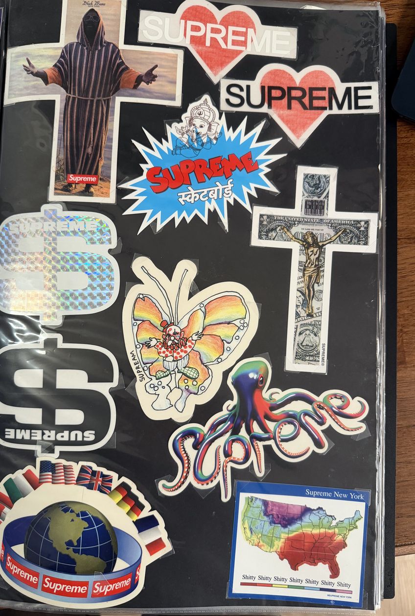 Binder page — Supreme heart, cross, butterfly, and globe stickers