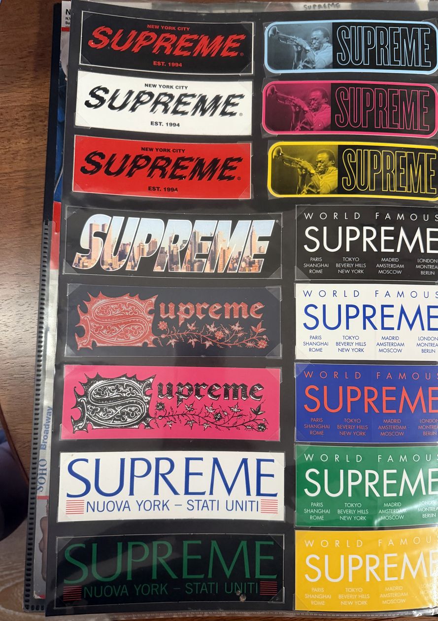 Binder page — box logo bars and World Famous stickers