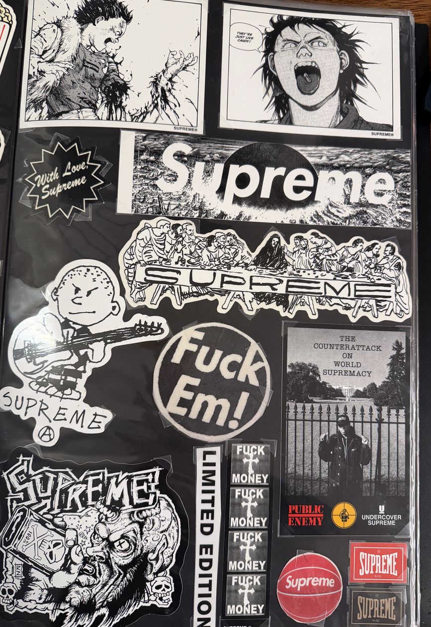 Binder page — Akira, Fuck Em, and Limited Edition stickers