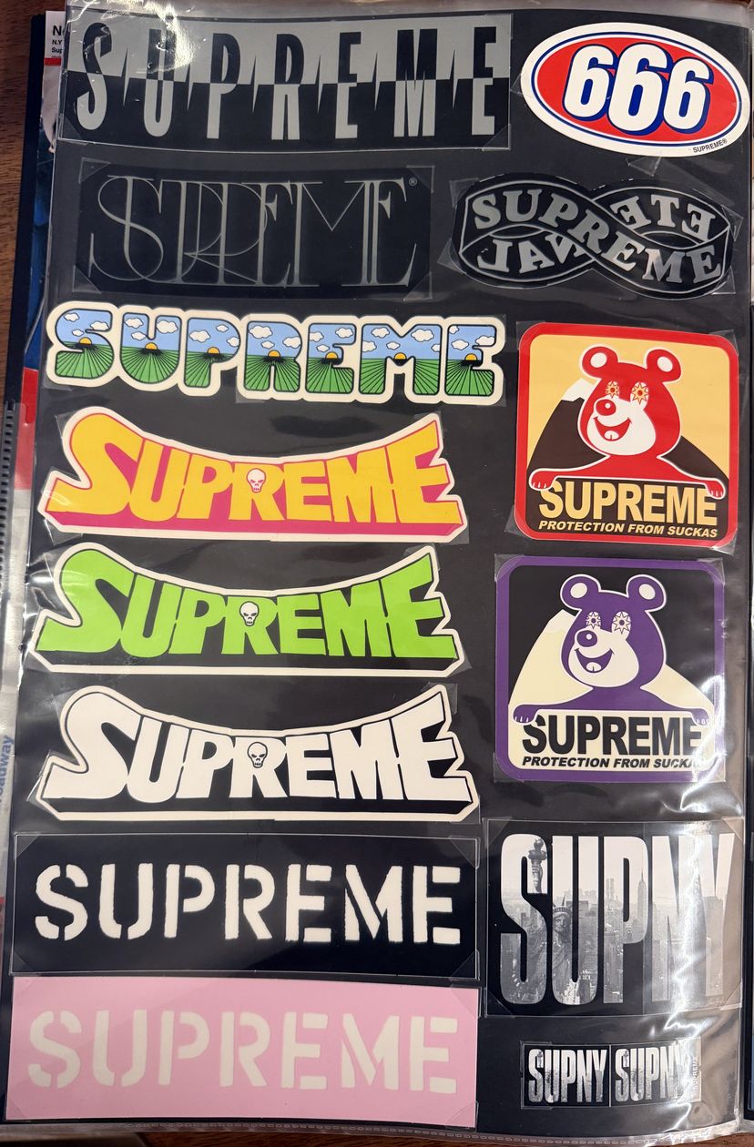 Binder page — 666, arc logos, and Supreme bear stickers