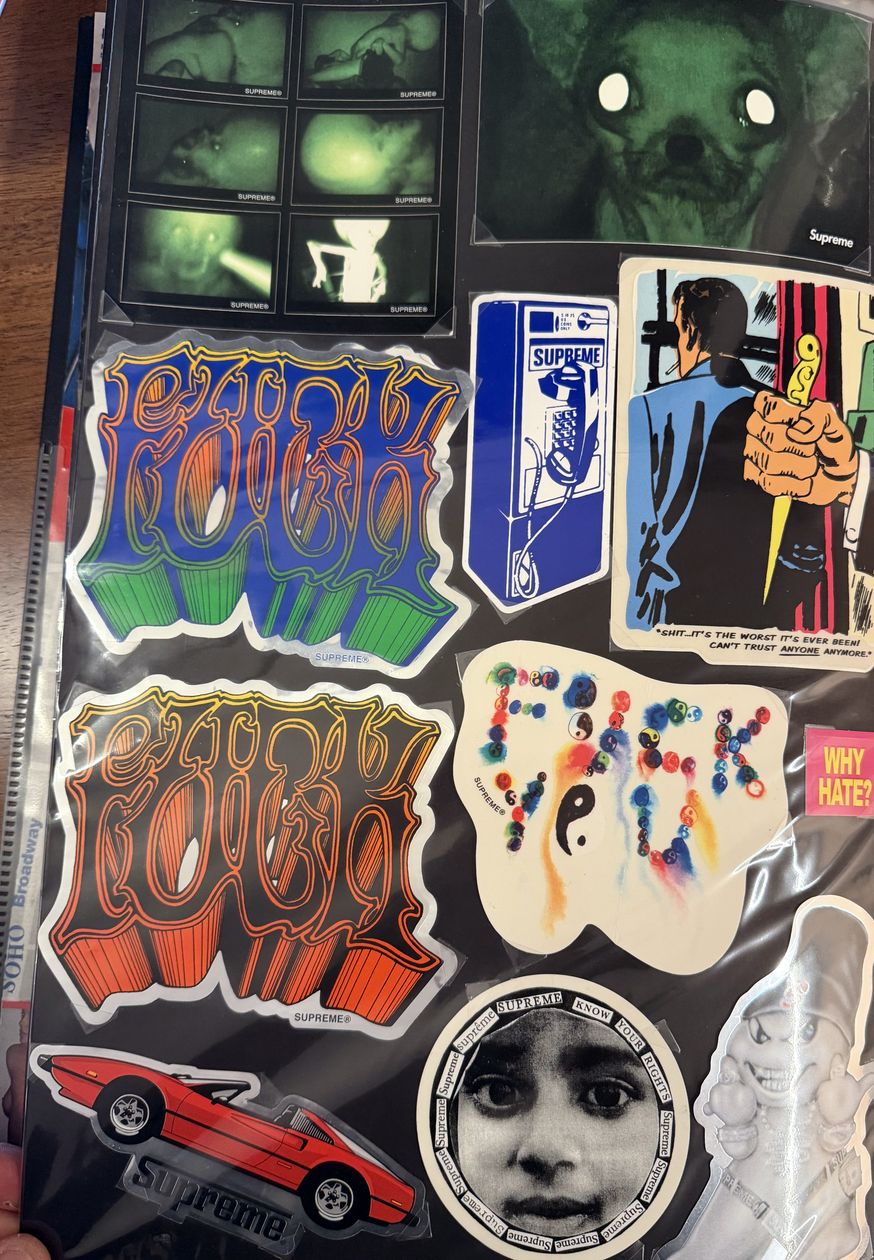 Binder page — graffiti Supreme and Fuck You stickers