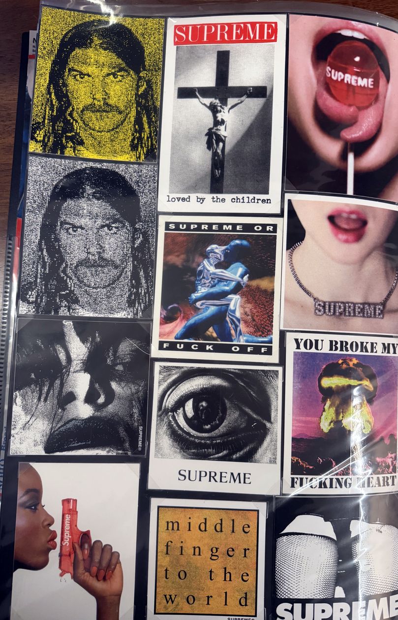 Binder page — Supreme photo stickers and Middle Finger to the World