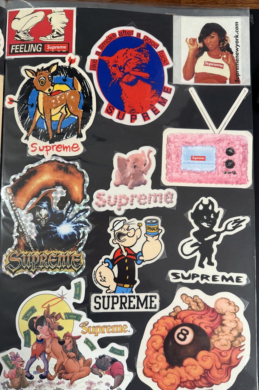 Binder page — Popeye, eight ball, and cartoon Supreme stickers